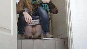 Juvenile blondie pulls down her jeans and pisses in the toilet