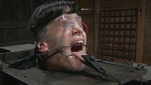 Elise tries connected with scream for help, but the word can`t be made out because of the clamps around her throat and tongue. He master turns up the force on the electrodes attached connected with her face and pussy and that babe nearly passes out.