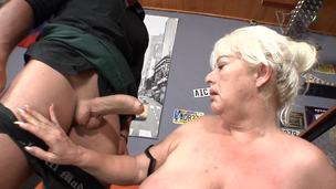 A fat granny is getting fucked hard in the bar in this video